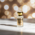 Gucci Oud Eau de Parfum bottle with gold cap and label on a white surface.